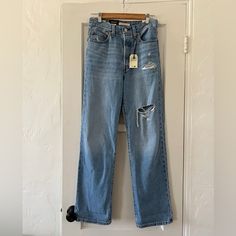 Super Cute Brand New, Never Worn Levi’s Ribcage Straight Ankle Jeans In Size 27, A *Non-Stretch* Straight Leg High Rise With A True Vintage Feel To The Wash And Light Distressing. These Are A 27 X 31. So 27” Waist & 31” Inseam, Although My Measurements Came To 30” See Below. These Look Super Cute Rolled/Cuffed As Well, Just Not Quite My Size. Measurements Taken Flat Waist 14” Rise Approx 12” Inseam Approx 30” Tags: Light Wash Vintage Style Denim Vintage Style Levi’s Lightly Distressed Coastal Co Levi's Distressed Bottoms For Fall, Levi's Distressed High Rise Jeans, Levi's Ripped Straight Leg Jeans, Levi's Blue Jeans With Frayed Hem, Levi's Dark Wash Cutoff Jeans, Levi's Denim Flare Jeans, Levi's Denim Blue Flare Jeans For Spring, Levi's High Rise Jeans For Spring, Levi's High Rise Spring Jeans