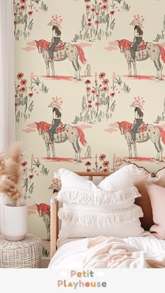 a bedroom with a horse wallpaper and pink flowers on the wall next to it