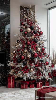 a christmas tree with red and silver ornaments