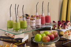 an assortment of fruits and desserts on a table