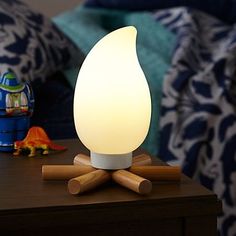 a night light sitting on top of a wooden table