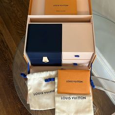 New Never Used Authentic Louis Vuitton Joaillerie Trunk Jewelry Box. Holds Bracelets, Necklaces, Watches And More. There Are 2 Drawers Inside Along With 2 Dust Pouches. Navy Blue Bracelets/Watch Box Is Removable With Gold Snap Closure. Authentic Lv Book And Cleaning Cloth Are Included . Outside Box Measures 8” Long X 5” Tall And 5 And 1/2” Deep. Comes With A Slip Over Cover. Makes A Beautiful Gift For Your Lv Lovers. Luxury Designer Jewelry With Original Box, Louis Vuitton Box Packaging, Louis Vuitton Gift Box Aesthetic, Louis Vuitton Watch Case, Bracelets Watch, Luxury Jewelry Box Louis Vuitton, Louis Vuitton Watches, Blue Bracelets, Louis Vuitton Gifts