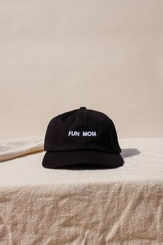 "Im not like a regular mom , I'm a fun mom." Intentionally Blank "Fun Mom" hat saying it all for you. cool mom One size. Adjustable back. Hand embroidered in LA. PIPE AND ROW Fun Black Cotton Baseball Cap, Everyday Fun Hats With Curved Brim, Fun Everyday Hat With Curved Brim, Fun Curved Brim Hat For Everyday Use, Fun Hats With Embroidered Logo One Size, Fun Hats With Embroidered Logo, Fun Embroidered Logo Hat One Size, Fun Embroidered Logo Baseball Cap, Fun Baseball Cap With Embroidered Logo