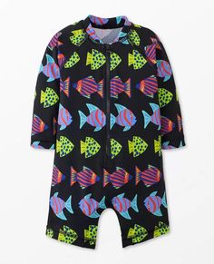 Baby Long Sleeve Rash Guard Swimsuit | Hanna Andersson Playful Swim Trunks For Ocean Activities, Playful Fitted Swim Trunks For Vacation, Playful Swimwear With Upf 50+ For Ocean Activities, Upf 50+ Swimwear For Ocean Activities, Upf 50+ Swimwear For Ocean Beachwear, Upf 50+ Beachwear For Ocean Activities, Playful Swim Trunks With Upf 50+ For Vacation, Playful Swimwear With Uv Protection For Ocean Activities, Printed Rash Guard For Summer Beachwear