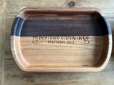 a wooden tray with writing on it that says many have contemplates remain