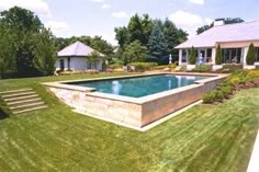 a large pool in the middle of a yard