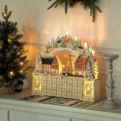 a christmas scene with a lighted gingerbread house