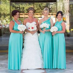 the bride and her four bridesmaids pose for a photo