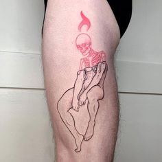 a person with a skeleton tattoo on their leg