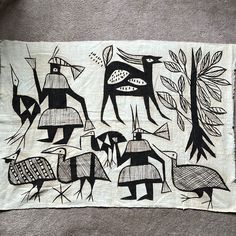 a piece of cloth with black and white designs on it