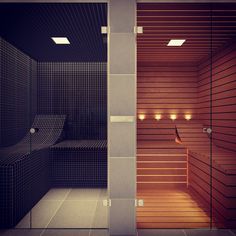 an empty sauna with lights in the middle