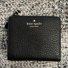 New With Tags. No Flaws. Fast Shipping Kate Spade Black Bag With Card Slots, Kate Spade Black Wallet With Interior Card Slots, Kate Spade Bifold Coin Purse, Black Leather Kate Spade Wallets, Chic Black Compact Wallet, Kate Spade Black Wallet With Zipper Closure, Kate Spade Compact Wallet For Everyday, Kate Spade Compact Everyday Wallet, Kate Spade Black Rectangular Wallet