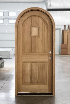 an open wooden door sitting inside of a garage