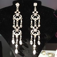 Rhinestone Chandelier Earrings. Metal Chandelier Earrings With Sparkling Stones For Formal Occasions, Elegant Jeweled Dangle Earrings, Elegant Dangle Chandelier Earrings With Sparkling Stones, Formal Chandelier Earrings With Sparkling Stones, Formal Metal Chandelier Earrings With Sparkling Stones, Elegant Metal Bridal Earrings With Rhinestones, Dangle Crystal Earrings For Evening, Elegant Jeweled Crystal Drop Earrings, Elegant Jeweled Crystal Earrings For Evening