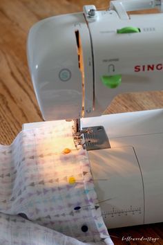 the sewing machine is working on the fabric