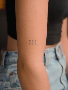 a woman's arm with the number 11 on it