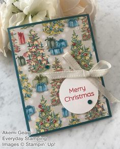 a christmas card with flowers and a tag