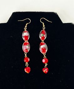 Vintage Venetian & Millefiori Red Glass Beaded Earrings  In great condition  Earrings measure 9cm Handmade Red Flower Earrings For Festive Occasions, Red Drop Flower Earrings For Festive Occasions, Festive Red Flower Drop Earrings, Elegant Red Heart Beads Earrings, Red Heart Beads Earrings For Party, Red Dangle Earrings With Heart Beads, Red Vintage Earrings For Celebrations, Red Heart Bead Drop Earrings, Red Flower Earrings With Colorful Beads As Gift