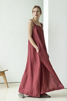 This maxi red dress is cut from airy natural linen that has an elegant design so is perfect for summer evening gatherings or walks on the beach. The dress features loose silhouette, square neck and asymmetrical side slits for extra feminine feel. Tie it with a belt to define frame.Complement the dress with heels and style with a basket bag.  #sustainablefashion #naturalmaterials #linendress #reddress #maxidress #dresswithpockets Square Neck Linen Dress With Adjustable Straps, Linen Square Neck Dress With Adjustable Straps, Linen Dress With Adjustable Straps And Square Neck, Linen Square Neck Sundress, Linen Dresses With Spaghetti Straps And Pockets, Linen Dresses With Pockets And Spaghetti Straps, Linen Dress With Adjustable Straps And Straight Neckline, Summer Linen Maxi Dress With Square Neck, Elegant Sleeveless Linen Dress With Adjustable Straps