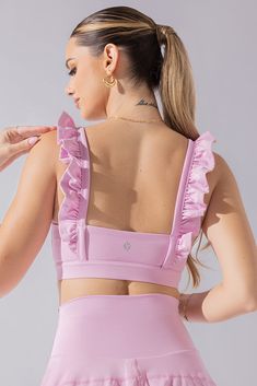 It’s a sports bra straight out of a romance novel. This bra features the most romantic, ruffled shoulder straps, a daring square neckline, and a flirty low back. Compression Level:  Performance Level: Feminine Workout Clothes, Girly Workout Outfits, Feminine Sportswear, Gymnastics Fits, Cute Workout Sets, Athletic Sets, Running Sets, Running Fits, Work Out Clothes