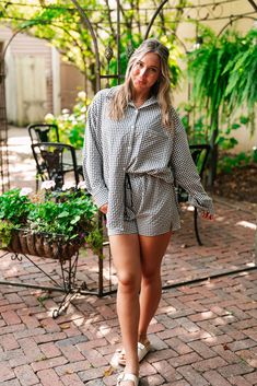 The Urban Moments Gingham Set - Top redefines modern chic with its relaxed, oversized silhouette and timeless gingham pattern. This top features a button-up front that adds a touch of classic sophistication, while the loose fit provides an effortlessly stylish and comfortable drape. Crafted from a soft, breathable fabric, it ensures all-day comfort and easy movement. Perfect for both casual outings and laid-back office wear, the Urban Moments Gingham Top is a versatile wardrobe staple that combi Chic Oversized Plaid Tops, Spring Gingham Tops For Loungewear, Relaxed Fit Gingham Tops For Workwear, Loungewear Dresses, Gingham Tops, Oversized Silhouette, Short Leggings, Modern Chic, Sandals For Sale