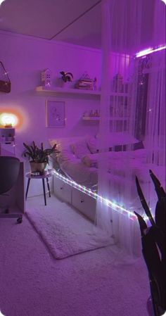 a bedroom with purple lighting and white carpet