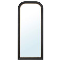 a large mirror sitting on top of a white wall next to a black framed object