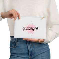 a woman is holding a laptop with the words eco economy on it