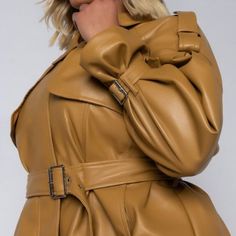 The Plus Azalea Wang Keeping It Short And Classy Pleather Crop Trench Is Made From A Vegan Leather Fabrication, And Is Complete With A Cropped Length, Front Flap Detail, Epaulette Shoulder Detail, A Collared Neckline, Two Side Pockets, Buckle Wrist Details, Waist Belt, And A Front Zipper Closure. - 94% Polyester 6% Spandex - Hand Wash Cold Yellow Long Sleeve Leather Jacket, Chic Mustard Outerwear For Work, Yellow Leather Long Sleeve Outerwear, Yellow Leather Jacket With Long Sleeves, Yellow Leather Jacket For Spring With Long Sleeves, Yellow Long Sleeve Leather Jacket For Fall, Yellow Long Sleeve Leather Jacket For Spring, Yellow Leather Winter Outerwear, Yellow Leather Jacket For Fall