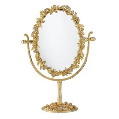 an ornately decorated mirror on a stand