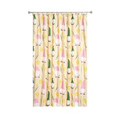 a curtain with flowers on it and pink, yellow, and white curtains in the background