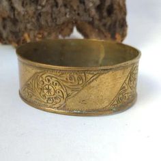 jewelry Bracelet Vintage African Bronze Berber Old Ethnic African Antique Engraved Moroccan Bracelet Hippy boho Womens Bangle Ethnic This breathtaking vintage bracelet is a perfect illustration of Traditional African craftsmanship. It has been made using bronze and brass, the large bangle is a showcase of rich cultural heritage and unique skill of the berber people. This vintage bracelet epitomizes excellent African and Moroccan jewelry development. It consists of bronze and brass with a massive Bohemian Festival Bracelets, Gold Bohemian Bracelets For Rituals, Bohemian Antique Gold Brass Bracelets, Bohemian Antique Gold Adjustable Bracelets, Bohemian Antique Gold Bracelets For Gift, Bohemian Gold Engraved Bracelets, Bohemian Gold Engraved Bracelet, Adjustable Bohemian Brass Bracelets, Bohemian Metal Bangle For Festivals