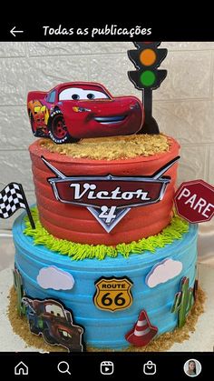 a birthday cake made to look like the cars from disney pixar is on display