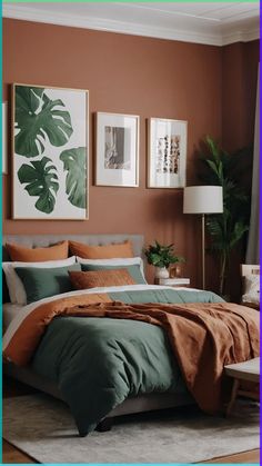 a bedroom with orange and green bedding in front of a painting on the wall