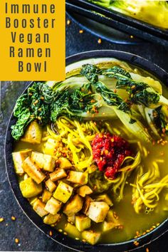 a bowl filled with broccoli, noodles and other vegetables on top of a table