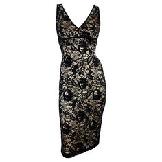 From the early 2000s, this knee-length Dolce & Gabbana dress blends black floral lace over champagne-colored satin, creating an elegant wardrobe staple. The chic design features a v-neckline, thin shoulder straps, and a semi-exposed back. Approximate measurements: Size - 40IT Bust: 34 - 38" Waist: 28 - 32" Hips: 36 - 42" Shoulder to hem: 42" 85% nylon, 15% lycra Elegant Wardrobe, Gabbana Dress, Skull Dress, Dolce Gabbana Dress, Boucle Jacket, 1980s Dresses, Color Champagne, Gowns With Sleeves, Eyelet Dress