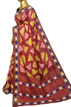 Look classier than ever with our fresh collection of pure tussar silk saree with elegant work on kantha stitch embroidery, Gujrati stitch, and mirror work on the whole body, pallu, and border to make it more enticing with the use of multi-colored hand shibori dye work. Color: A shade of maroon and multiple colors Technique: A pure and refined hand-done Kantha stitch, Gujarati Mirror, and stitch work along with multi-colored hand shibori dye work Fabric: Tussar Quality: IndyVogue's Assurance of S Luxury Saree With Multicolor Embroidery And Zari Weaving, Festive Multicolor Pre-draped Saree With Motifs, Navratri Multicolor Pre-draped Saree With Motifs, Festive Multicolor Chanderi Pre-draped Saree, Multicolor Pre-draped Saree With Motifs For Puja, Multicolor Pre-draped Saree With Zari Work For Puja, Multicolor Motif Pre-draped Saree For Puja, Red Tussar Silk Pre-draped Saree With Motifs, Art Silk Traditional Wear For Navratri