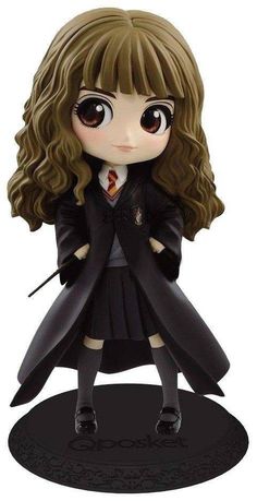 a harry potter figurine with long hair and big eyes is posed on a black base