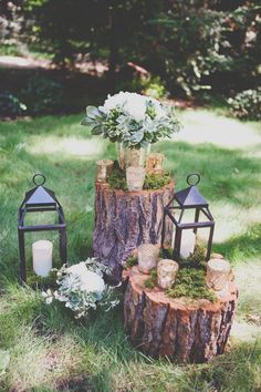 a tree stump with candles and flowers on it