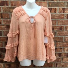 Gorgeous Ruffled Detail, Tie Neckline, Nwt Size Medium, Color Peach Spring Brunch Tops With Ruffles, Spring Ruffled Tops For Brunch, Flowy Ruffled Tops For Brunch, Feminine Spring Blouse With Ruffles, Spring Brunch Blouse With Ruffles, Spring Ruffle Blouse For Brunch, Spring Ruffle Sleeve Blouse With Ruffle Hem, Bohemian Ruffle Sleeve Tops For Spring, Bohemian Ruffle Tops For Brunch