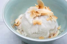 a bowl filled with ice cream topped with nuts