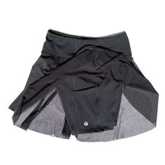 The Black Pocket Skort is *the* perfect piece that combines your favorite elements of a fashionable tennis skirt and a workout short. A tennis skirt with a twist, in basic blackt, to wear to your favorite workouts, or out on the town. The built-in shorts are shaped to hug and sculpt your curves in our buttery-soft, 4-way stretch, moisture-wicking fabric. Pair it with the matching Lina Top for a little black dress look or with our Lina Bra under a Jacket down for a chic look.  One side open mesh Workout Short, Black Skort, High Fashion Looks, Short A, Mesh Skirt, Recycled Yarn, A Workout, Tennis Skirt, Independent Designers Fashion