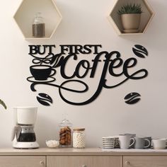 a wall mounted sign that says, but first coffee