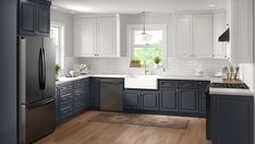 a large kitchen with blue cabinets and white counter tops, hardwood flooring and wooden floors