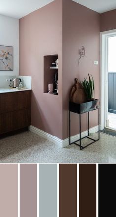 a bathroom with pink walls and brown accents