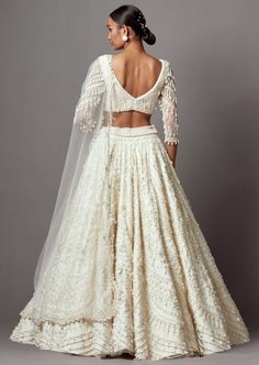 Embroidered lehenga with pearls and silver embellishments paired with a beaded blouse and dupatta. Lehenga Blouse Designs Full Sleeves, Heavy Necklace, Latest Bridal Lehenga, Lehenga Blouse Designs, Ivory Blouse, Saree Blouse Patterns, Embroidered Lehenga, Beaded Blouse, Designer Saree Blouse Patterns