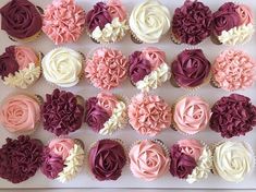 cupcakes decorated with pink, white and purple flowers