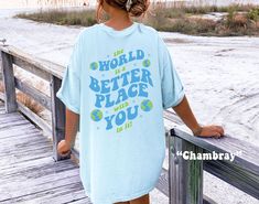 Spread a message of Kindness & Mental Health with this cute The World Is A Better Place With You In It Shirt! This Preppy Comfort Colors® Tshirt is so comfy! Size up for a Trendy Oversized Look! ♥ Hello and Welcome to Meaningful Tees Shop! ♥ Models are wearing Comfort Colors® Chambray, White, Black ♥ All of our items are made one at a time with care for each customer : ) ♥ Please allow 3-7 BUSINESS days (usually 3-5) for your item to be created PLUS shipping time via USPS ♥ UNISEX TEES fit like a Mens Shirt on Women, but are not overly large. ♥ For a RELAXED FIT, your usual size will typically work, but please consult the Size Chart in the Listing Photos ♥ For a TRENDY OVERSIZED FIT, size up 1, 2, or 3 Sizes! (2 sizes up is most common) ♥ For a SNUG FIT, size down 1 size. ♥ When in doubt, Jesus Shirts Christian Clothing, Ocean Tshirt, Vsco Shirts, Womens Christian Shirts, Christian Clothes, Faith Tshirts, Preppy Shirt, Gift Aesthetic, Bible Women