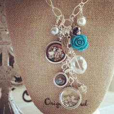 a necklace with buttons and charms attached to it