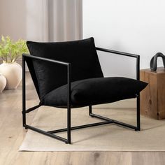 a black chair sitting on top of a wooden floor